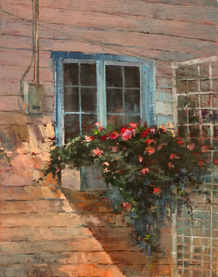 Flowers in bloom, filling a window planter on one of Lagunas original cottages